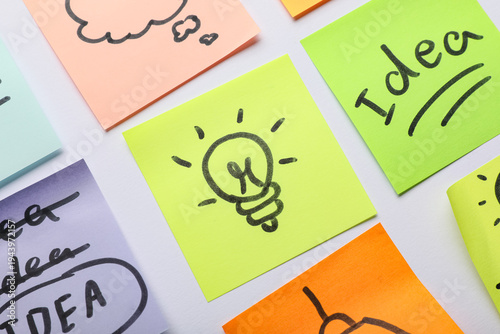 Sticky notes with drawn lig...