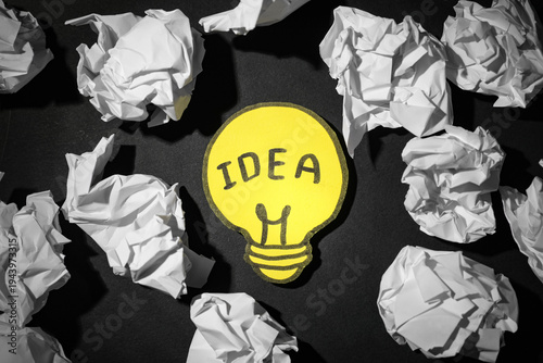 Paper light bulb with word ...