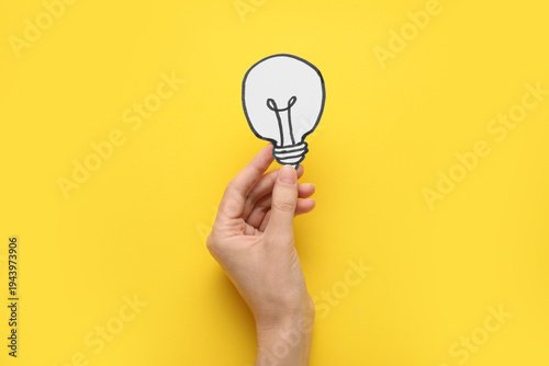 Female hand with paper ligh...