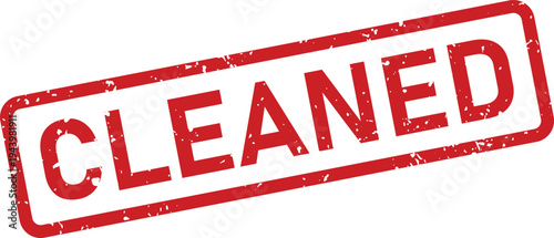 Red grunge rubber stamp mark with the word CLEANED on a white document surface