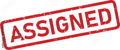 Red textured rectangular rubber stamp indicating an item or task has been officially assigned on a white surface