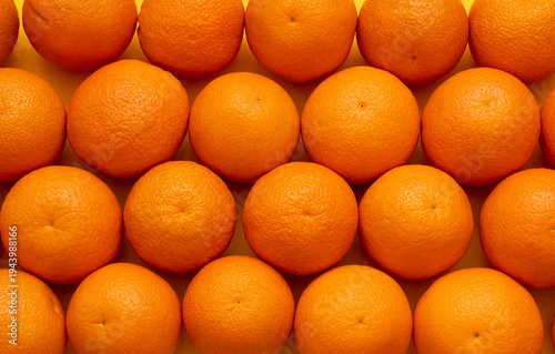 Many whole oranges pile, clementine fruits background