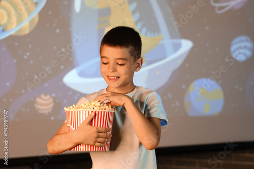 Cute happy boy with popcorn...