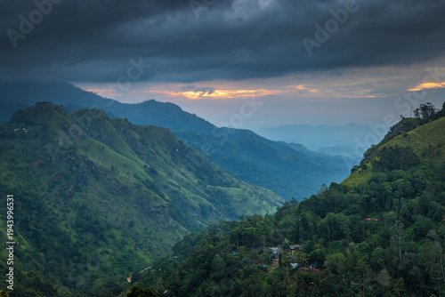 Dramatic Mountain Valley Landscape at sunrise with Overcast Sky and Lush Greenery, Serene Nature Overview. Mountain landscape near Ella in Sri Lanka.