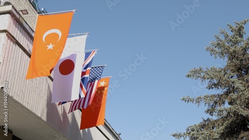 The flags of Turkey, Japan, Great Britain, the United States, and China flutter in the wind