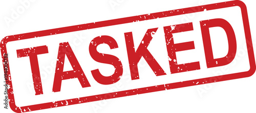 A distressed red rubber stamp impression clearly displaying the word TASKED diagonally on a clean white surface