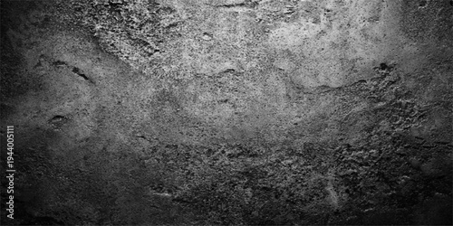A dark aged metal texture with a grungy vintage wall pattern featuring a rough dirty surface of old gray concrete and weathered black stone material