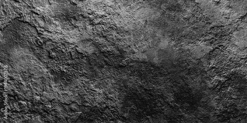 A dark, grungy concrete wall texture with an aged black stone surface features a rough, dirty cement pattern and vintage grey material for a distressed industrial backdrop design