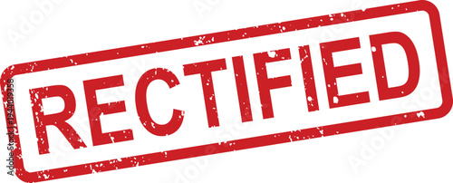 A red rectangular grunge textured rubber stamp prominently features the word RECTIFIED on a crisp white surface