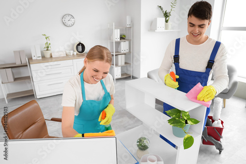 Young janitors cleaning des...