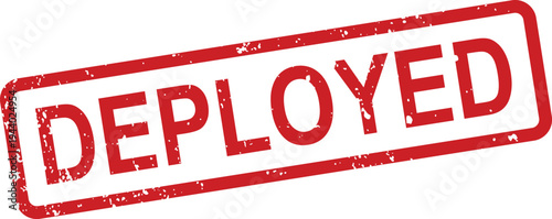 A striking red rectangular rubber stamp with a grunge texture displays the word deployed on white