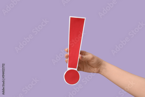 Female hand with red paper ...