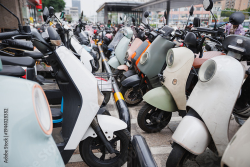 Electric scooters parked near the exit of subway station,, Shenzhen, Guangdong, China