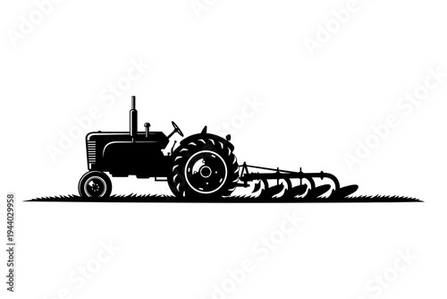 Silhouette tractor with plow on field: classic farming scene in black and white