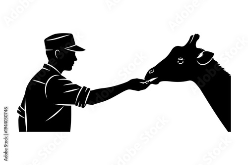 Silhouette of farmer feeding goat - agriculture and rural life concept