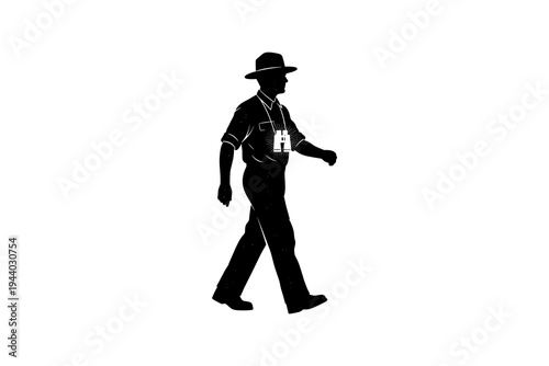 Silhouette of walking park ranger with binoculars