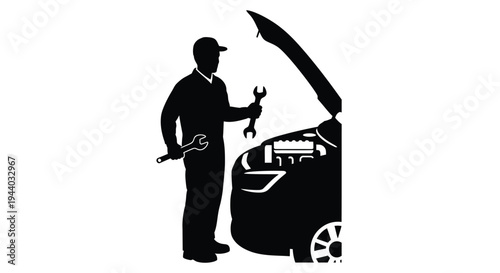 Silhouette of a mechanic working on the engine of a car