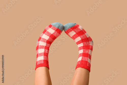 Legs of young woman in warm...