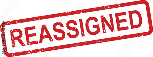 An eye catching red grunge rubber stamp boldly displays the important word REASSIGNED on a clear white surface