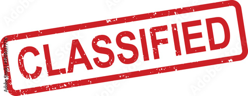 An official red rubber stamp displaying the word CLASSIFIED with a weathered effect on a bright white surface