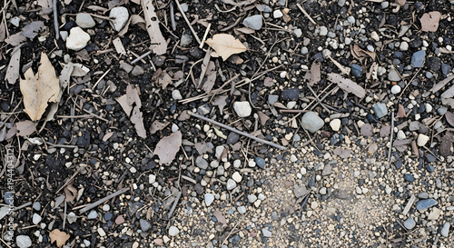 Gravel and soil mixed ground texture with natural earth stones and rough terrain structure creating realistic outdoor background for environmental and construction design