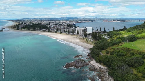 Aerial drone view of Mount Maunganui beach and coastal cityscape, Tauranga, New Zealand