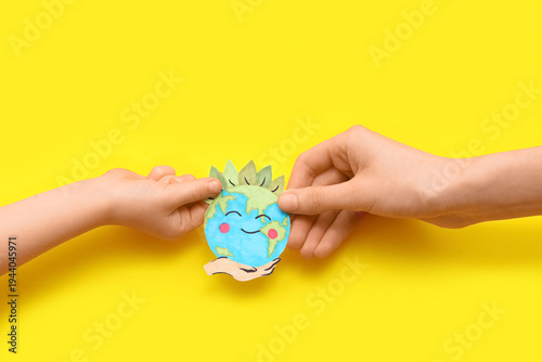 Child's and female hands wi...