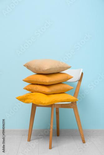 Stack of cushions on chair ...