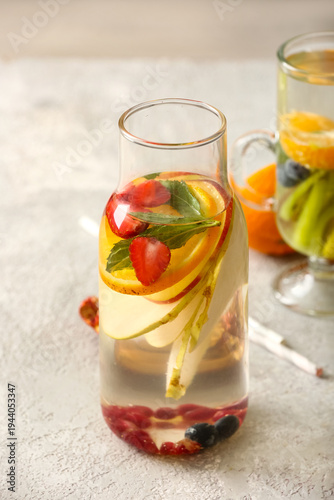 Bottle and glass of infused...