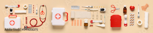 Quadro su tela Content of first aid kit on beige background, top view