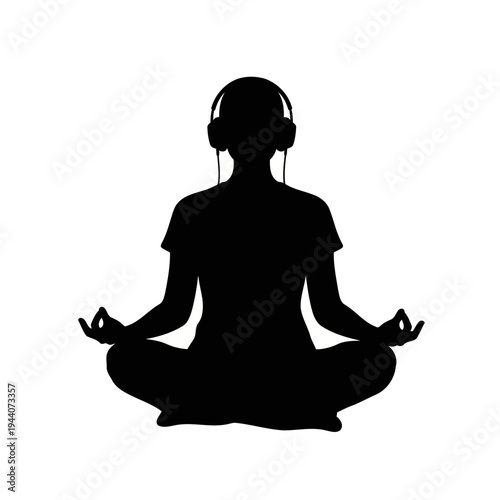 A person meditates peacefully while listening to music with headphones on