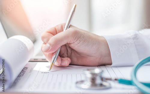 Medical doctor writing on prescription paperwork, patient personal health care record discharge form in hospital office, clinic center for healthcare and life insurance concept