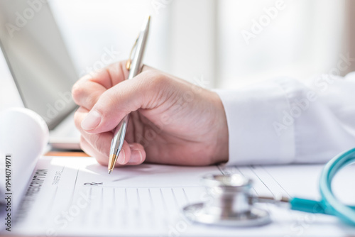 Medical doctor writing on prescription paperwork, patient personal health care record discharge form in hospital office, clinic center for healthcare and life insurance concept