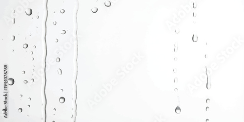 Close up of water droplets and trickles sliding down a clean white surface or glass pane.