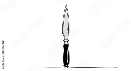 Close-up of a vintage letter opener with black handle and silver blade