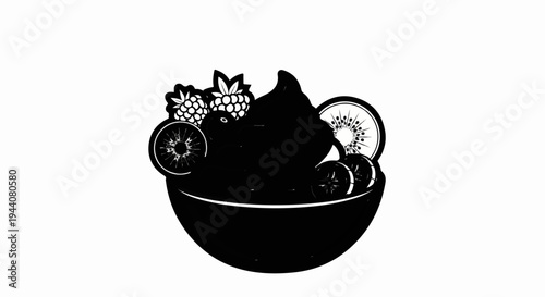 A dark bowl overflows with frozen dessert topped with berries and kiwi slices