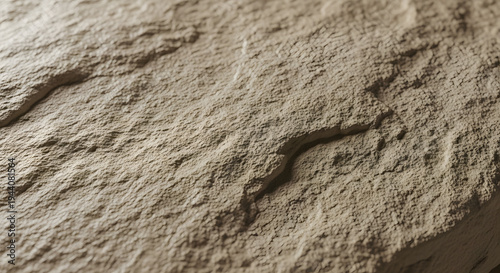 Rough clay earth texture with natural dry soil ridges and cracked terrain surface forming realistic desert ground background for environmental and geology concepts