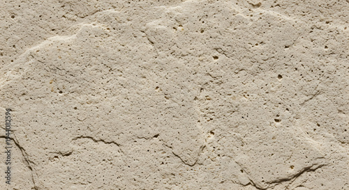 Beige plaster wall texture with subtle rough surface and natural light creating minimal abstract background suitable for modern design and architecture visualization