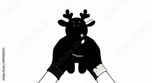 Hands in striped mittens hold a dark reindeer puppet with antlers