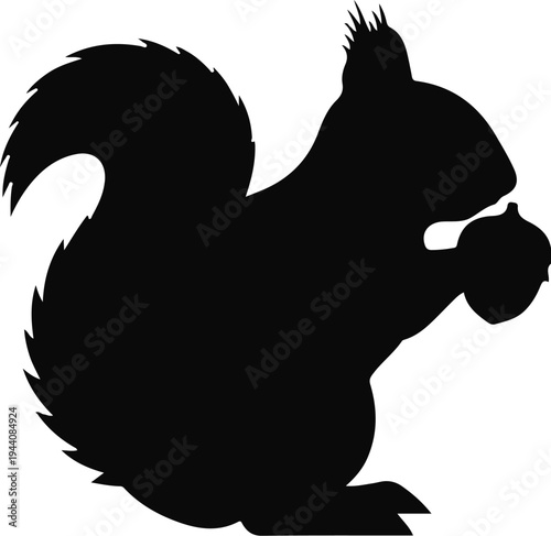 Silhouette of a bushy-tailed squirrel holding a nut in its paws