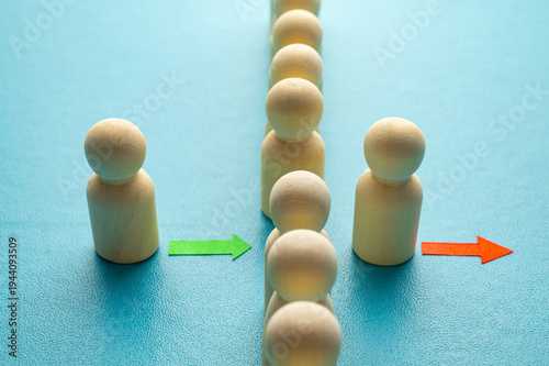 Concept of staff turnover, hiring, and firing, in a company, expressed with wooden pawns.
