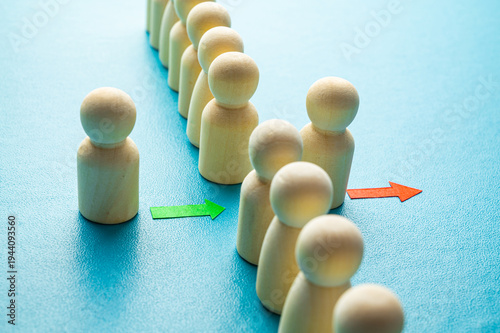 Concept of staff turnover, hiring, and firing, in a company, expressed with wooden pawns.
