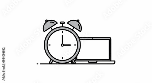 Alarm clock next to laptop computer.