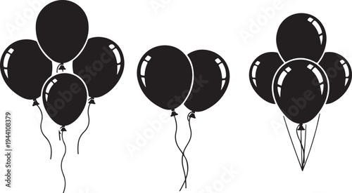 Group of black party balloons floating on strings against a transparent grey background celebration