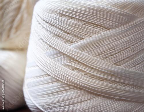 creamy white fibers textured yarn closeup background blurred textile industry