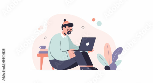 A person sits on the floor with a laptop, books, and a mug nearby