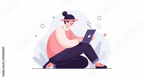 Person sitting cross-legged using a laptop