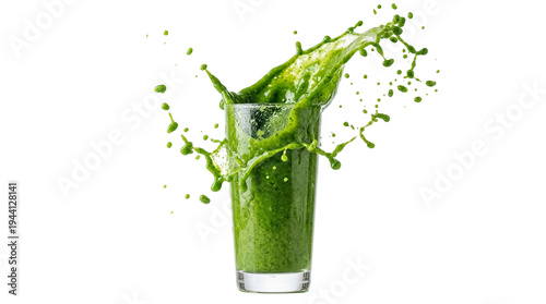 Photos Vibrant green smoothie splashing dynamically from a clear glass, a healthy detox