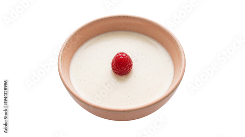 Slika na platnu Creamy vanilla bean panna cotta dessert with a vibrant red raspberry on top, per
