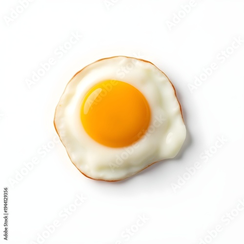 A fried egg with a runny yolk sits on a plain surface